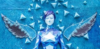 Origami i zen: w jaki sposób składanie papieru stało się formą medytacji Niebieski anioł origami w pozie jogi z ozdobnymi skrzydłami i wzorem geometryczn